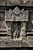 Prambanan - Candi Lara Jonggrang, miniature shrines surmounted by small fluted stupa with panels with musicians and dancers decorating the top of the balustrade 